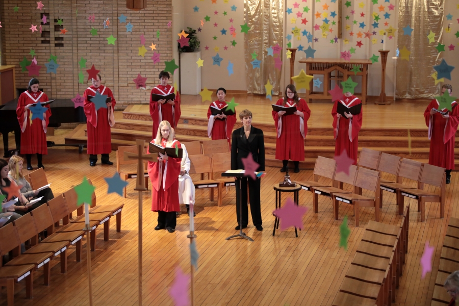 CSP Choir performing in Red robes.