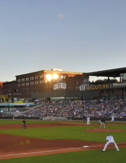 Outdoor baseball stadium in summertime in the evening.