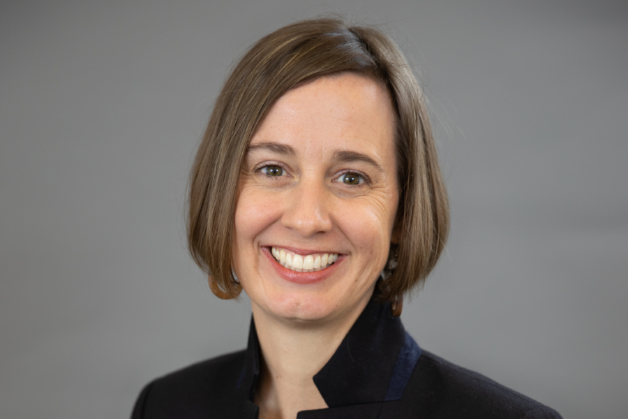 Portrait of Laura Wangsness Willemsen with gray background.