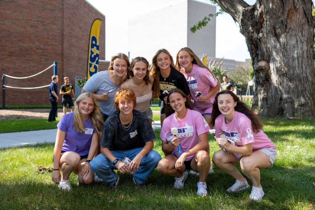 Group of students outside at CSP's campus holding ice cream treats.