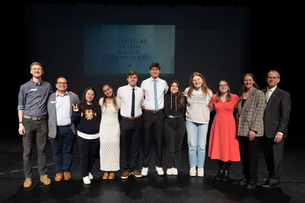 Group of students and staff on stage at the Ignite Leadership awards in spring 2025.
