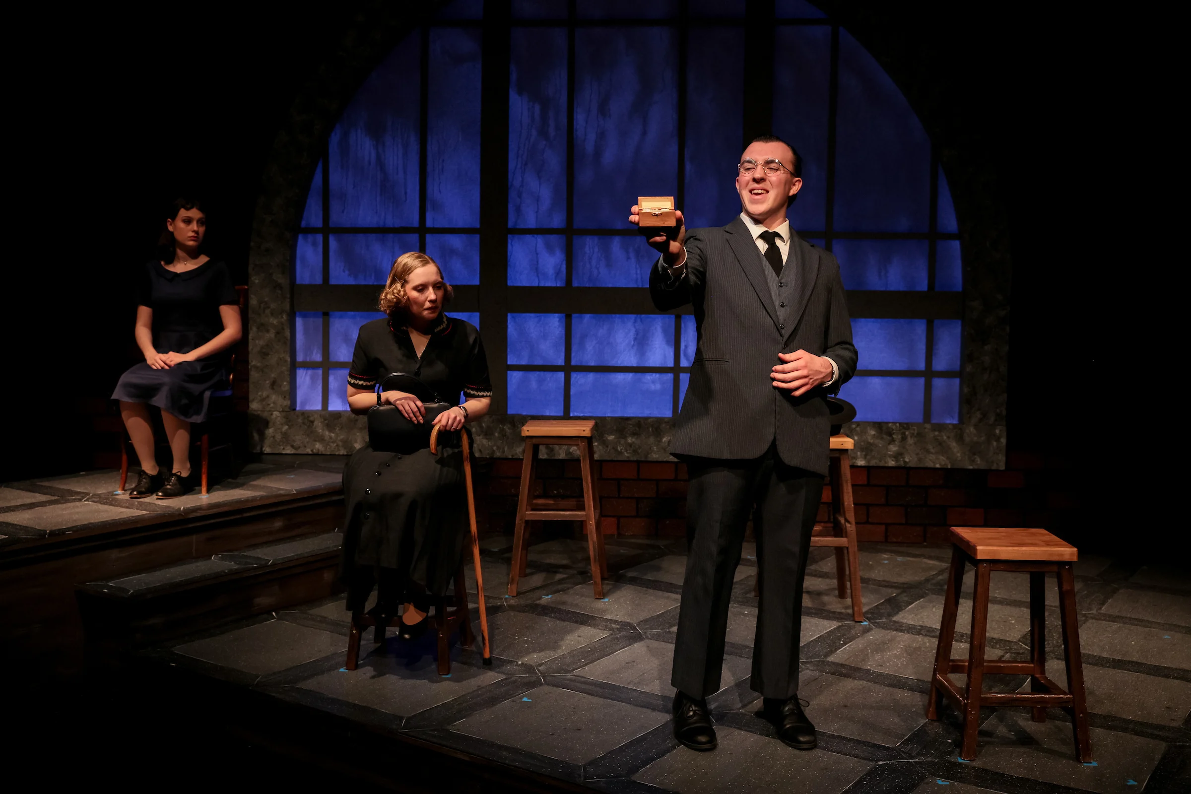 Three students on stage for a play performance in CSP's theatre.