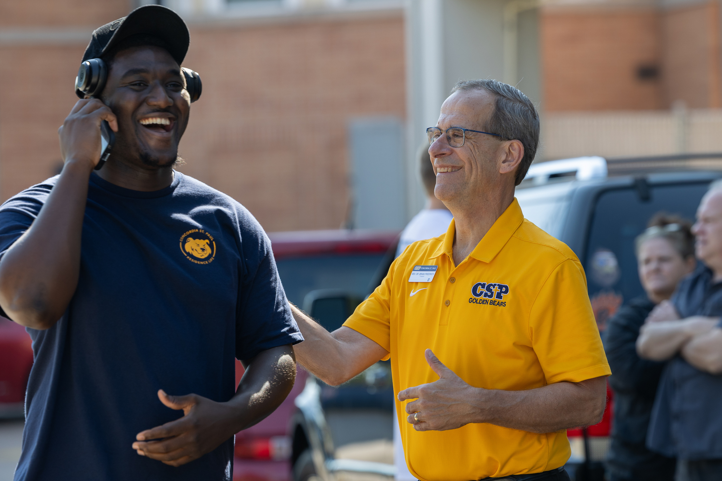 CSP President Brian Friedrich talking with a student on move-in day.